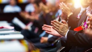 Closeup of business people hands applauding at meeting